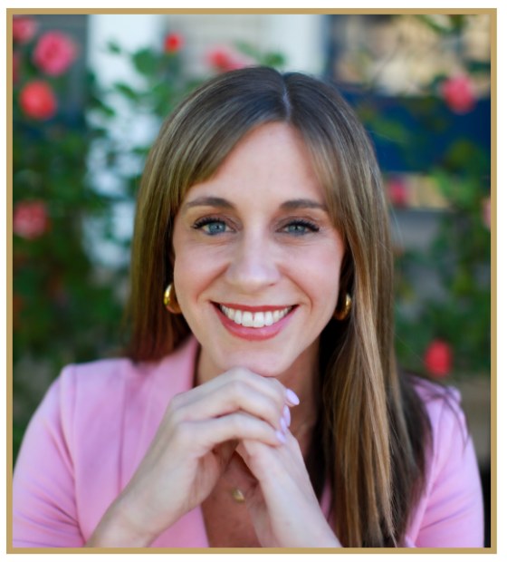 Dr. Heather Evans, smiling, in a pink jacket.