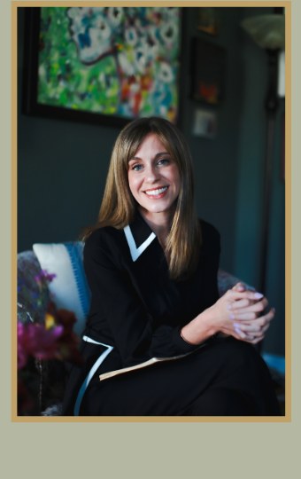 Dr. Heather Evans seated with a notebook.